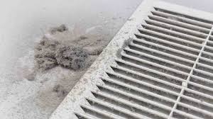 Visible dust around air vent cover in Illinois home showing need for air duct cleaning