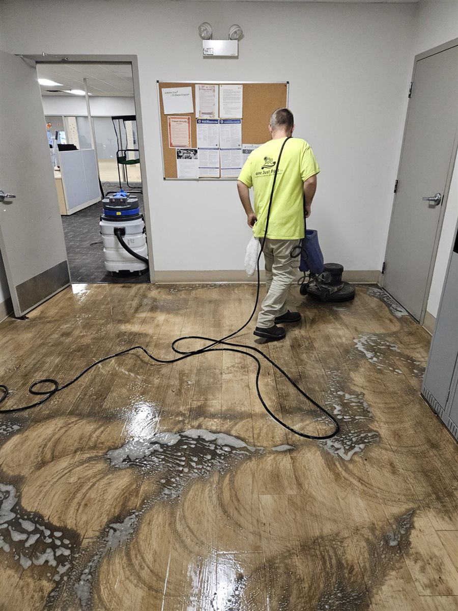 Done Just Right technician deep scrubbing hard floors at a Chicagoland office
